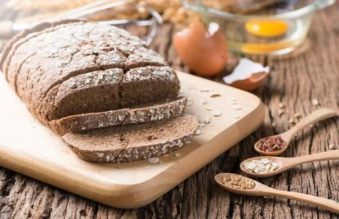 Homemade Cereal bread with raw egg Stock Photos