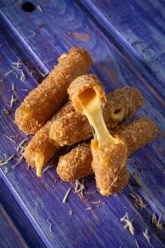 Homemade cheese sticks in breading Stock Photos