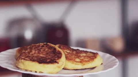 Homemade cheesecakes rotate on a plate Stock Footage 241564862