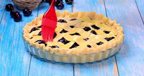 Homemade cherry pie brushed with the egg wash before baking 스톡 동영상 137916746