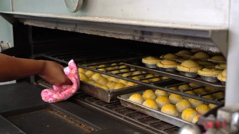 Homemade Chinese moon cakes are baked in the oven Stock Footage