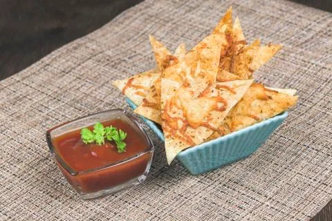 Homemade chips made from pita bread with cheese, herbs, spices and olive oil Stock Photos