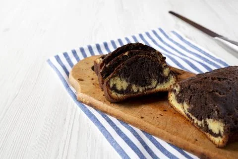 Homemade Chocolate and Vanilla Marble Cake on a rustic wooden board, side v.. Stock Photos
