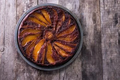 Homemade chocolate cake with pears in rustic style - sweet food concept Stock Photos