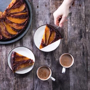 Homemade chocolate cake with pears in rustic style - sweet food concept Stock Photos