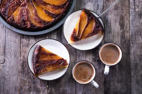 Homemade chocolate cake with pears in rustic style - sweet food concept Stock Photos