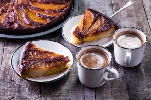 Homemade chocolate cake with pears in rustic style - sweet food concept Stock Photos