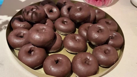 Homemade chocolate donuts Stock Footage 261672460