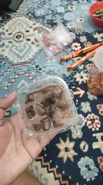 Homemade Chocolate Pudding with Ice Cubes in Plastic Cup Stock Photos