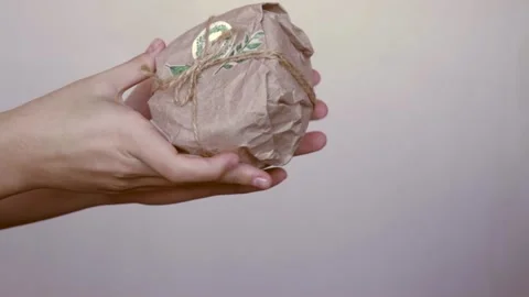 Homemade christmas present in reusable zero waste craft paper gift wrapping Stock Footage 165407185