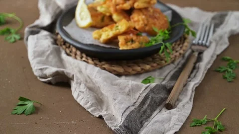 Homemade cod fish fritters in a rustic skillet 動画素材 338365547