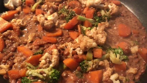Homemade cooking vegetable, carrot cauliflower, sauce, lentils and broccoli. Stock Footage