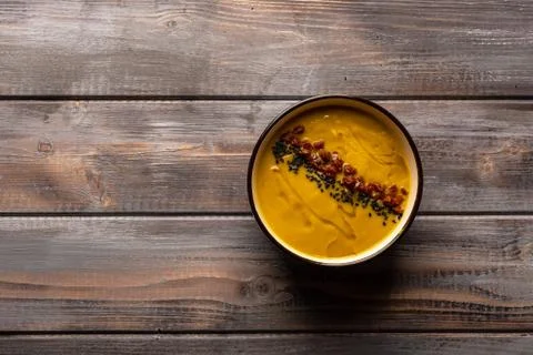 Homemade cream soup with a mixture of beans with red pepper and black sesame on Stock Photos