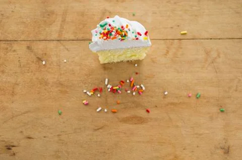 Homemade cupcake with missing bite Stock Photos