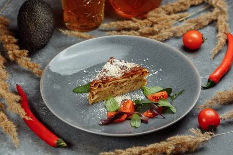 Homemade delicious Meat lasagna with basil leaf on the top. Close up. Recipe Stock Photos