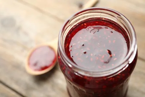 Homemade delicious raspberry jam on table, closeup Stock Photos