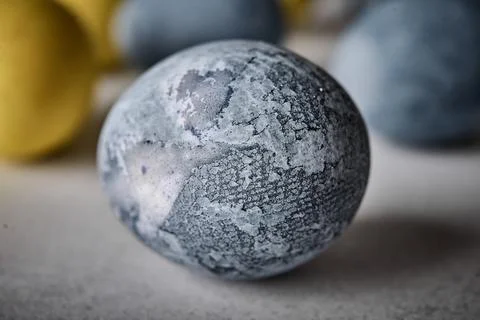 Homemade Easter colored grey marble egg Stock Photos