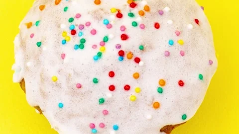 Homemade easter cupcake with white sweet icing sprinkled holiday easter Stock Footage 170238756