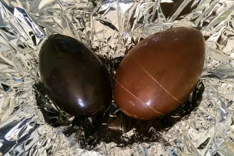 Homemade easter eggs on silver paper background - top view Stock Photos