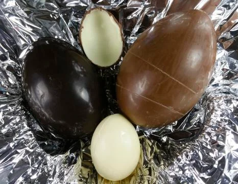 Homemade easter eggs on silver paper background - top view Stock Photos