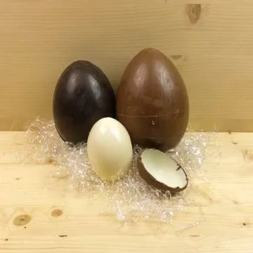 Homemade easter eggs on wooden background - side view Stock Photos