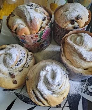 Homemade Easter Kulich and Cinnamon Rolls with Powdered Sugar Stock Photos