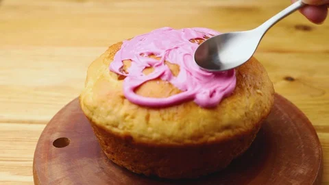 Homemade easter pie decorating with glaze on wooden board. Stock Footage 129777088