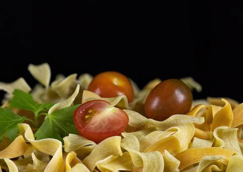Homemade egg paste with cherry tomatoes and parsley on a black background. Foto stock