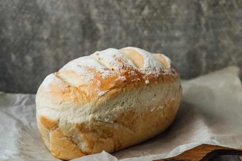 Homemade, fresh bread cools down after baking. Selective focus. place for tex Stock Photos