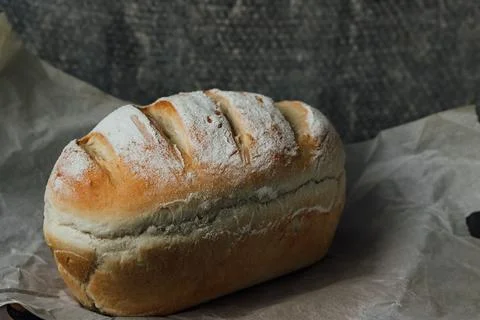 Homemade, fresh bread cools down after baking. Selective focus. place for tex Stock Photos