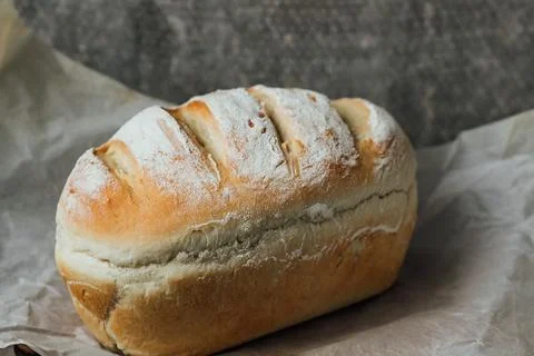 Homemade, fresh bread cools down after baking. Selective focus. place for tex Stock Photos