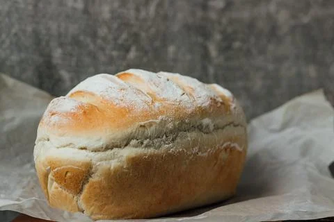 Homemade, fresh bread cools down after baking. Selective focus. place for tex Stock Photos