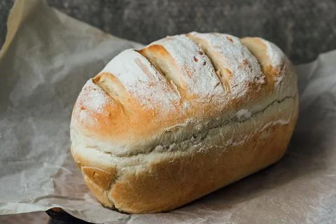 Homemade, fresh bread cools down after baking. Selective focus. place for tex Stock Photos