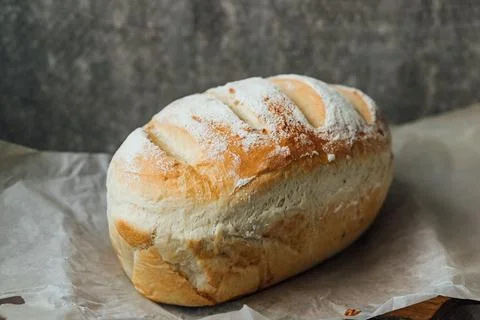 Homemade, fresh bread cools down after baking. Selective focus. place for tex Stock Photos