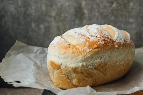 Homemade, fresh bread cools down after baking. Selective focus. place for tex Stock Photos
