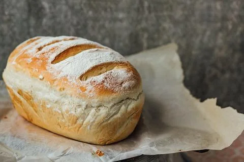 Homemade, fresh bread cools down after baking. Selective focus. place for tex Stock Photos
