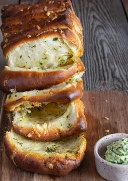 Homemade fresh pull apart bread with herbs (parsley, thyme, rosemary, dill) Stock Photos