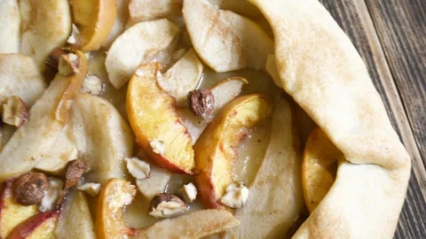 Homemade galette with different fruits with pears, peaches and nuts Stock Footage