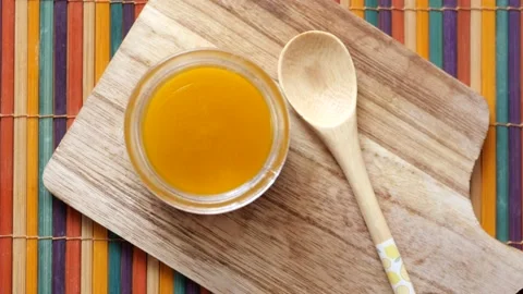 Homemade ghee in container on a table , Stock Footage 233739333