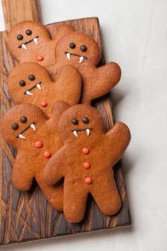 Homemade ginger biscuits in the shape of gingerbread men for Halloween. On the Stock Photos