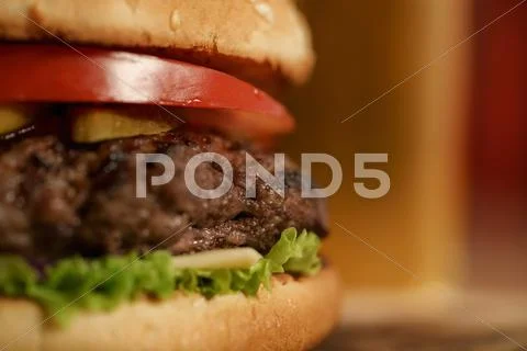 Homemade hamburger with beer on background Stock Photos