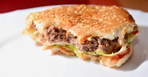 Homemade Hamburger with Missing Bites Stockfoto's