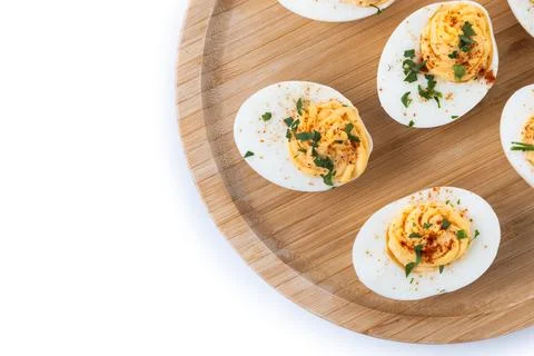 Homemade hard Boiled Deviled Eggs garnished with herbs 스톡 사진