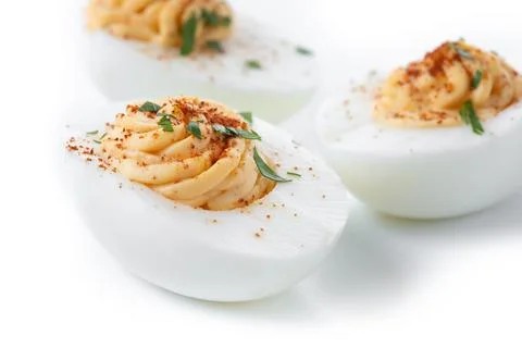 Homemade hard Boiled Deviled Eggs garnished with herbs 스톡 사진