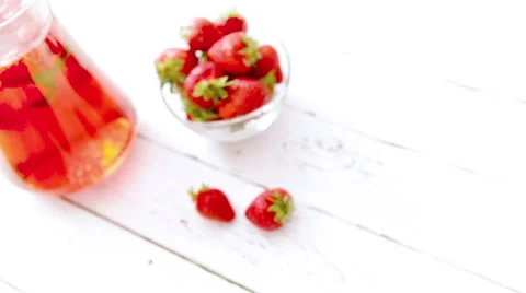 Homemade iced strawberry lemonade served with fresh strawberries Stock Footage 59677269