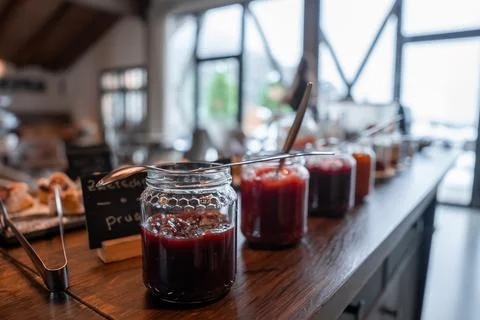 Homemade jam jars at breakfast buffet in a Dolomites boutique hotel Stock Photos