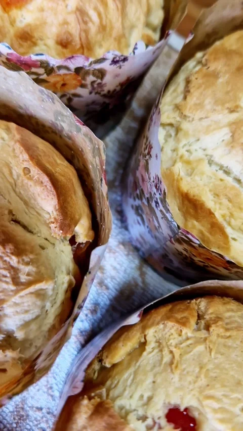 Homemade Kulich Easter Bread with Candied Fruit in Floral Paper Molds Stock Footage 338999517