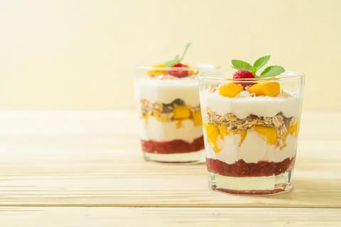 Homemade mango and raspberry with yogurt and granola Stock Photos