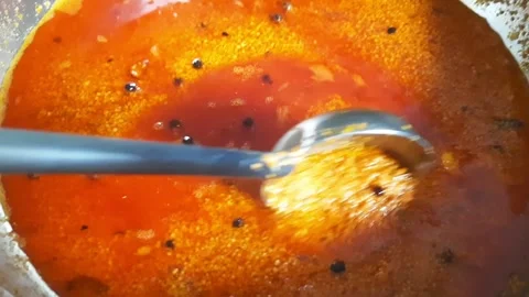 Homemade Mango Pickle Spice Mixture Being Stirred with Spoon Stock Footage 338168914
