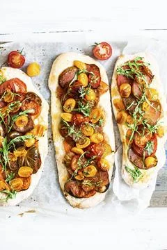 Homemade mixed tomatoes flatbread menu Stock Photos